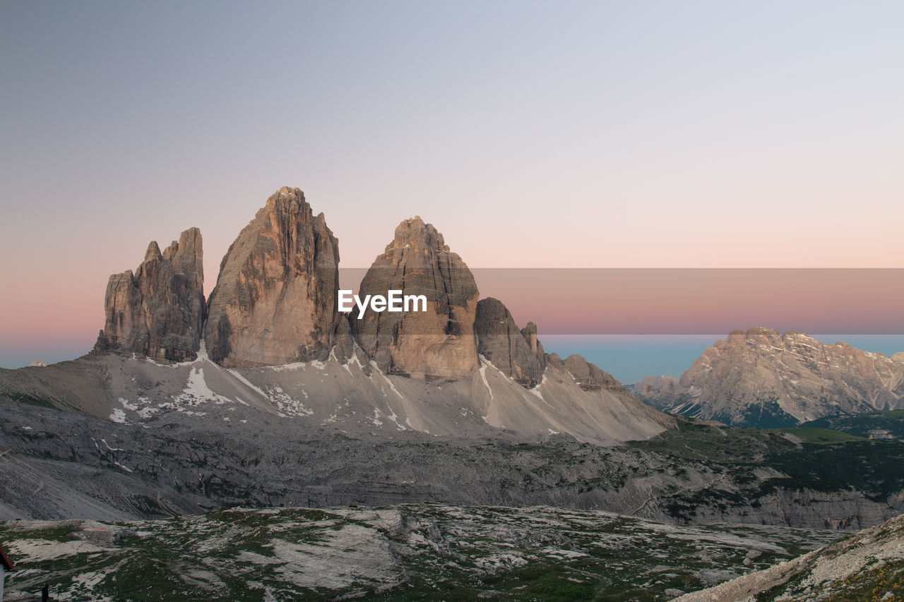 Rock formations on landscape against clear sky