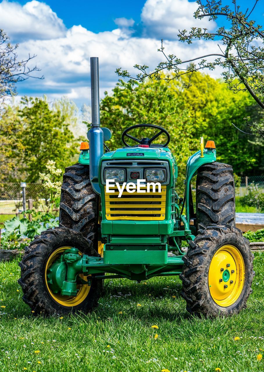 YELLOW TRACTOR ON FIELD