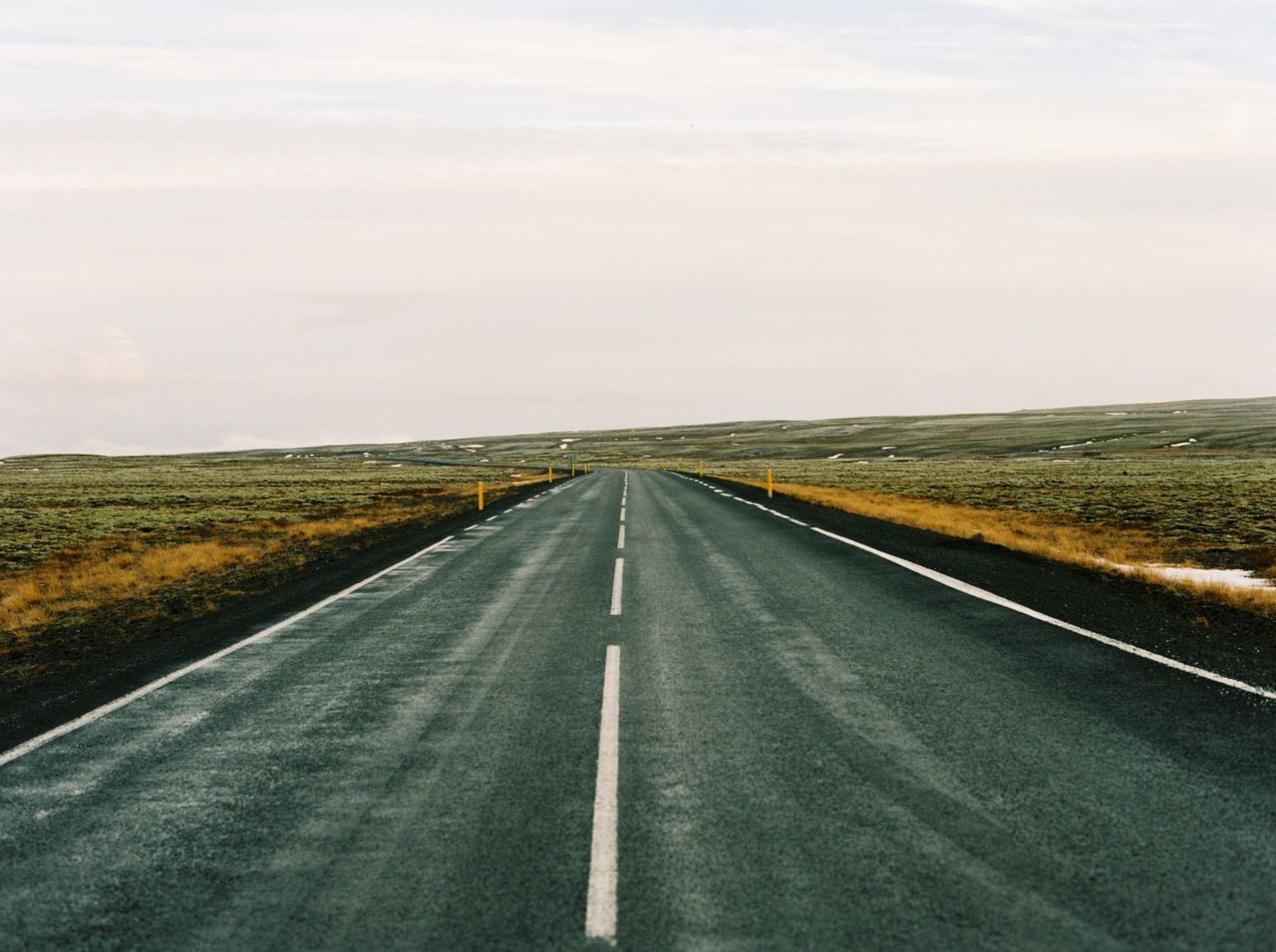 Empty road along landscape