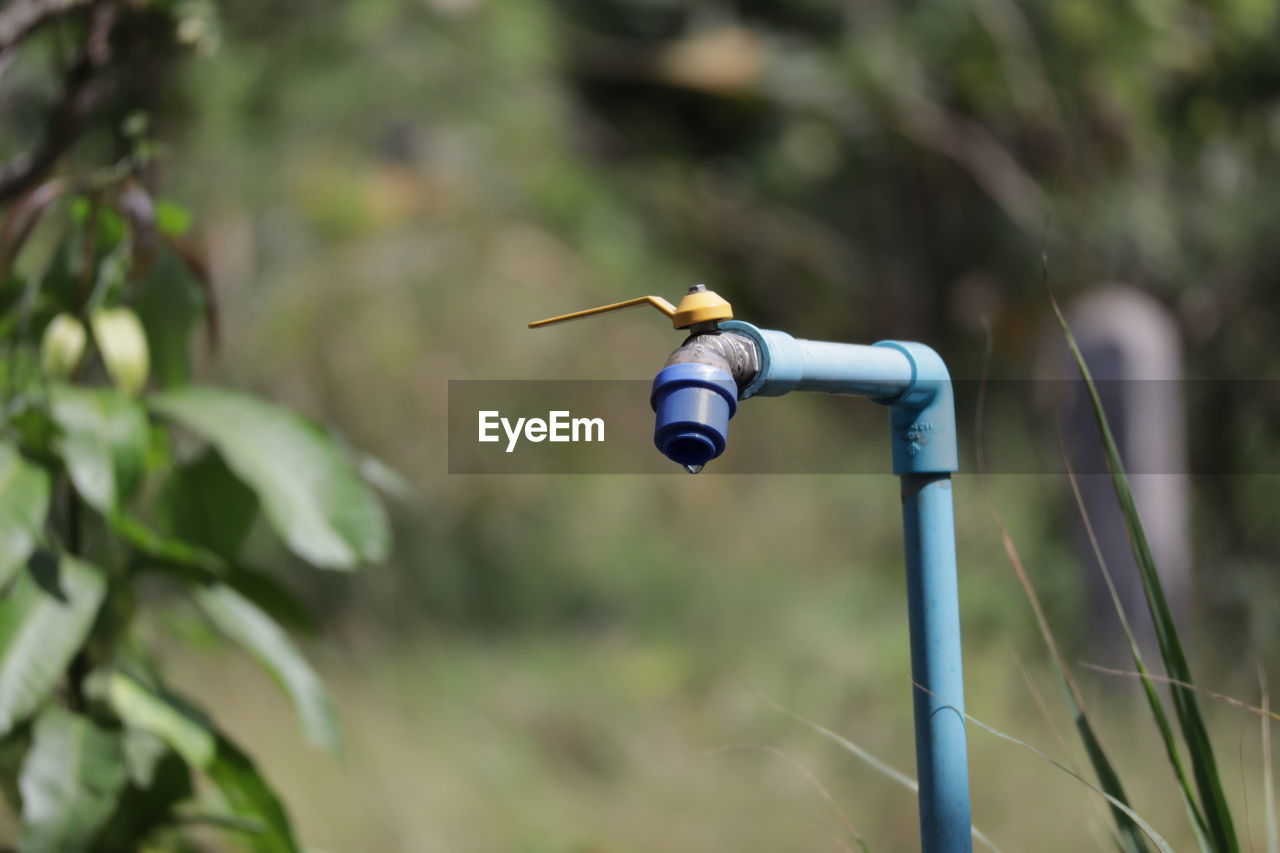 close-up of drone flying against blurred background