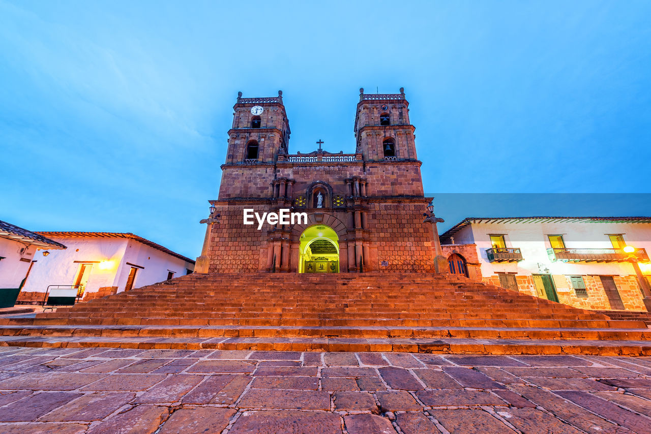 LOW ANGLE VIEW OF ILLUMINATED CATHEDRAL AGAINST SKY