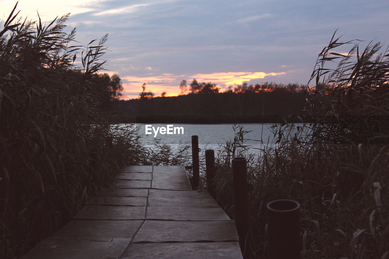 Scenic view of lake at sunset