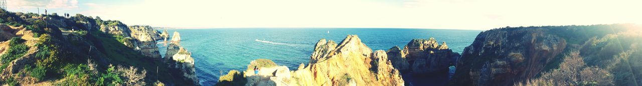 PANORAMIC VIEW OF SEA BY TREES AGAINST SKY