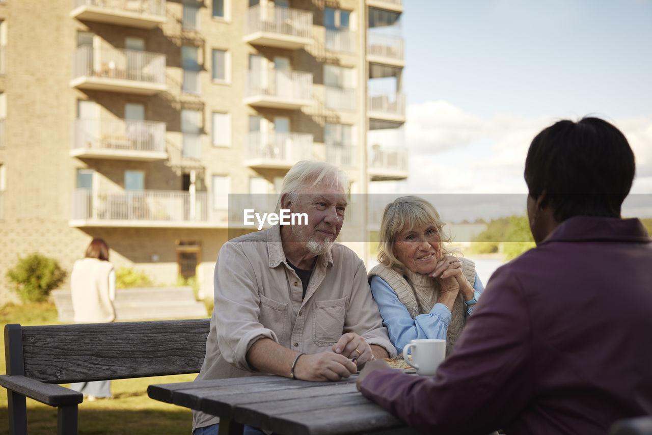 People having coffee together