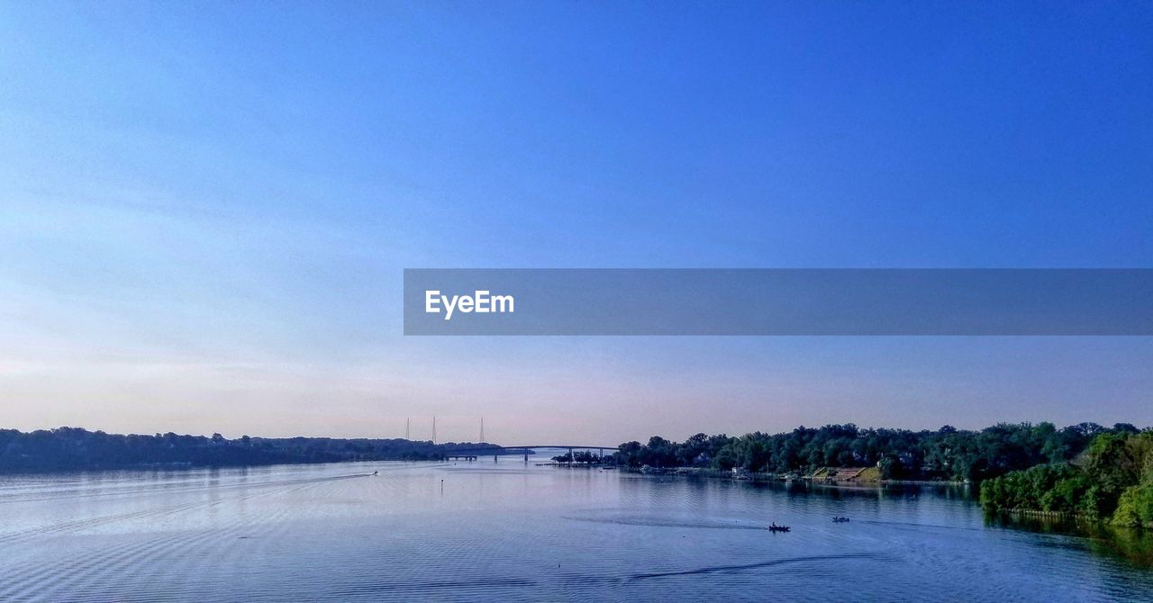 VIEW OF LAKE AGAINST BLUE SKY