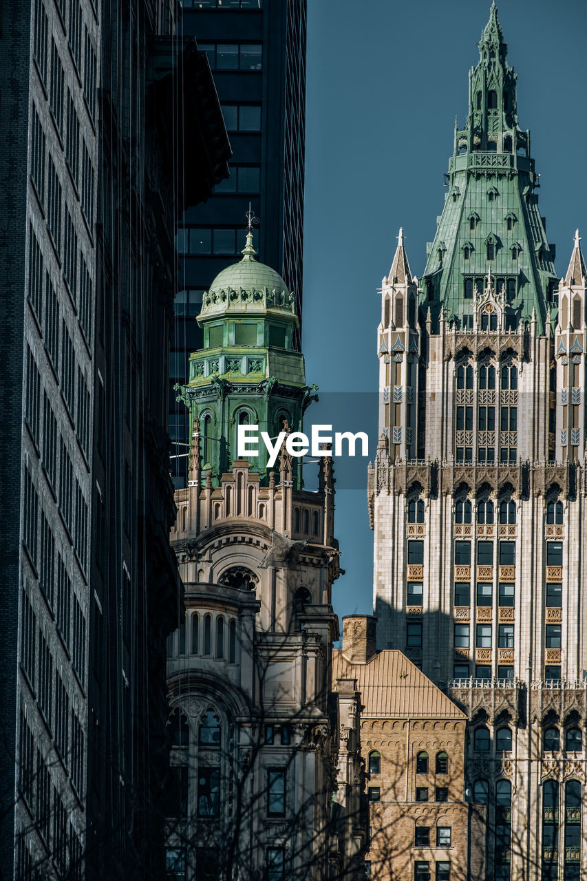 LOW ANGLE VIEW OF BUILDINGS AGAINST SKY