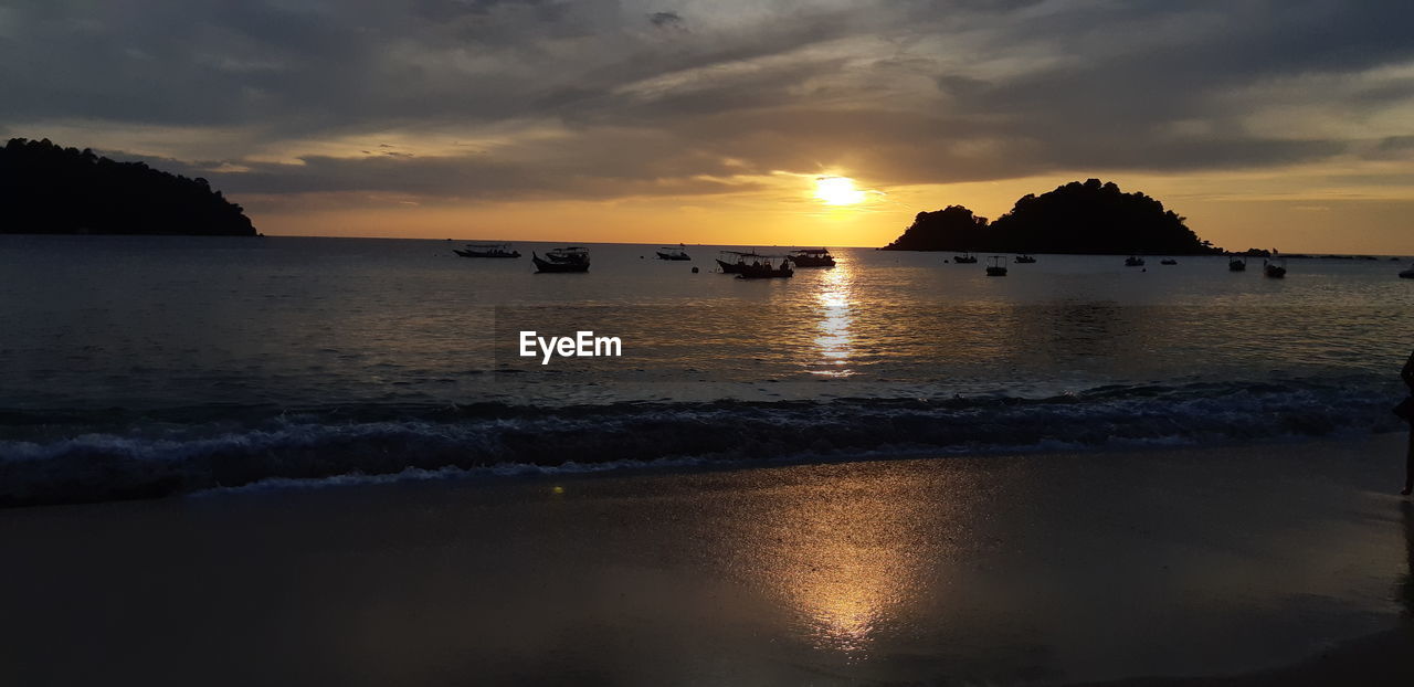 Scenic view of sea against sky during sunset