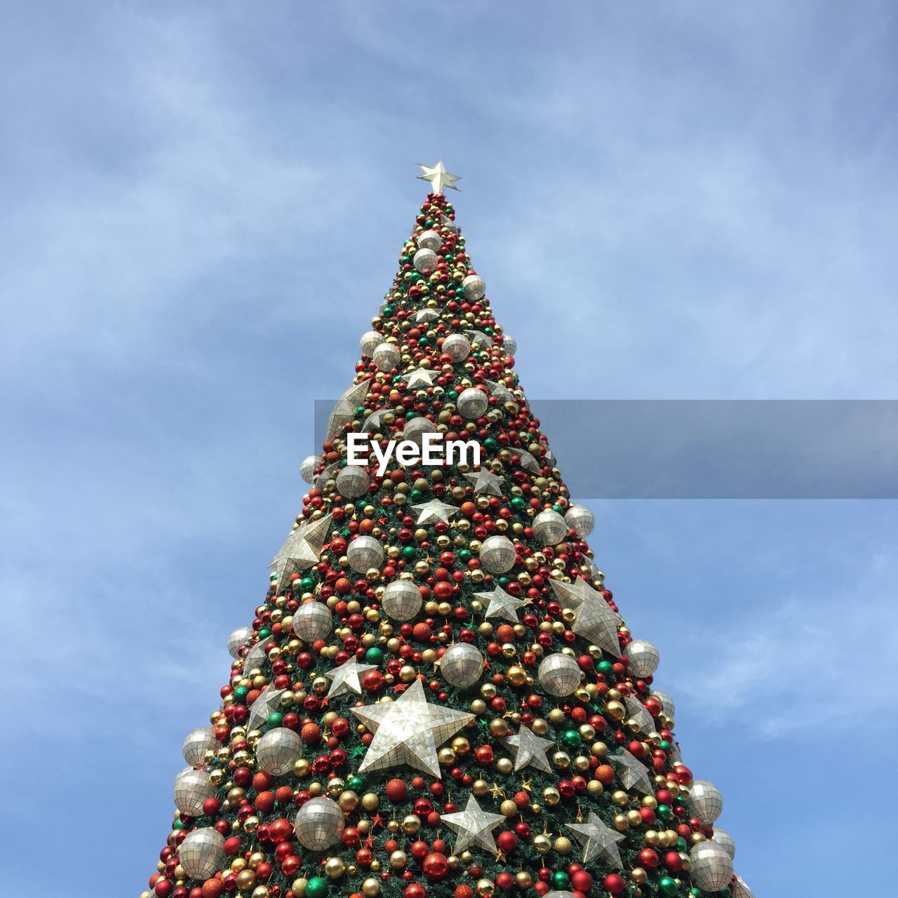 Low angle view of christmas tree against sky