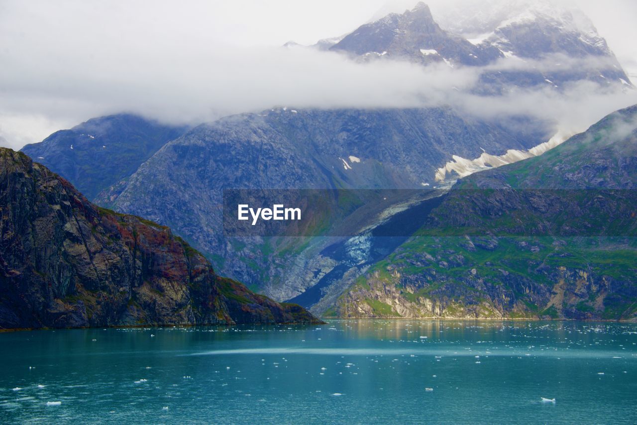 Scenic view of lake by mountains