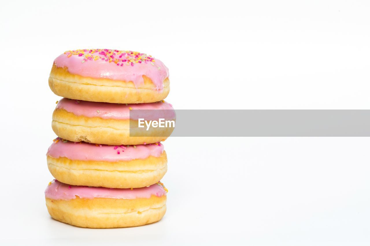 Close-up of donuts against white background