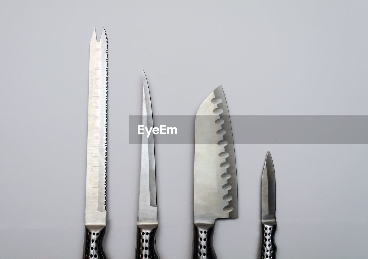 Close-up of knives on white background