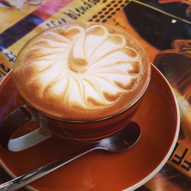 CLOSE-UP OF COFFEE CUP ON TABLE