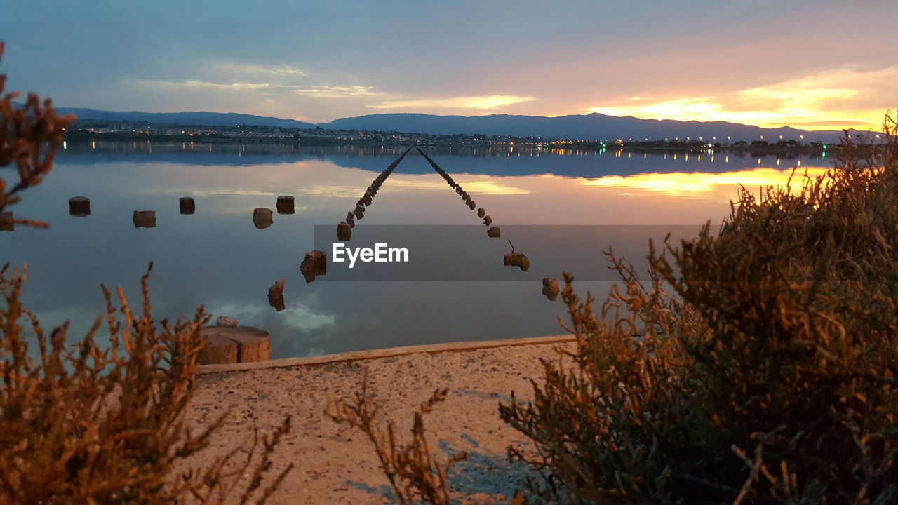 SCENIC VIEW OF LAKE DURING SUNSET