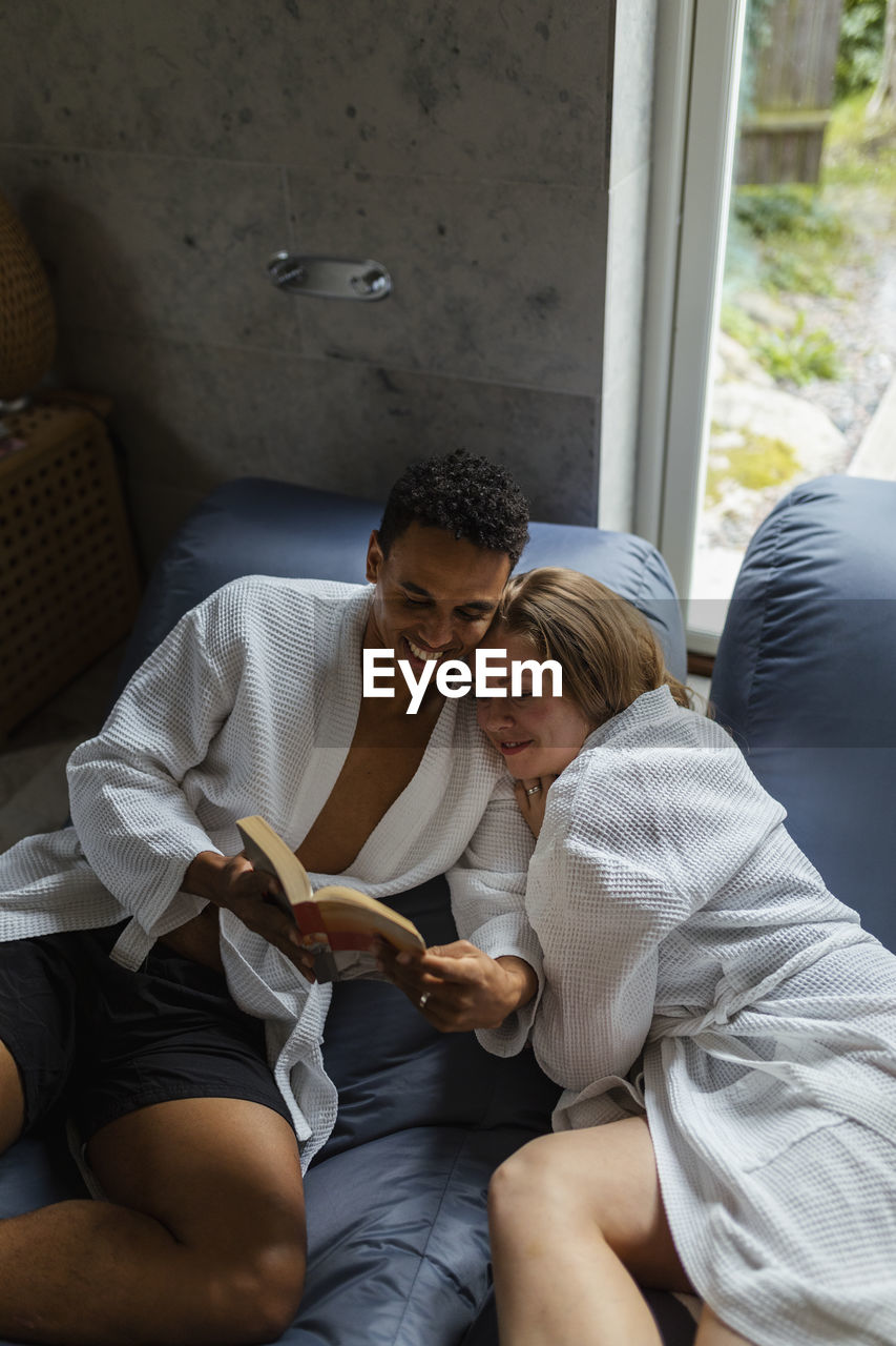 Couple relaxing together in living room