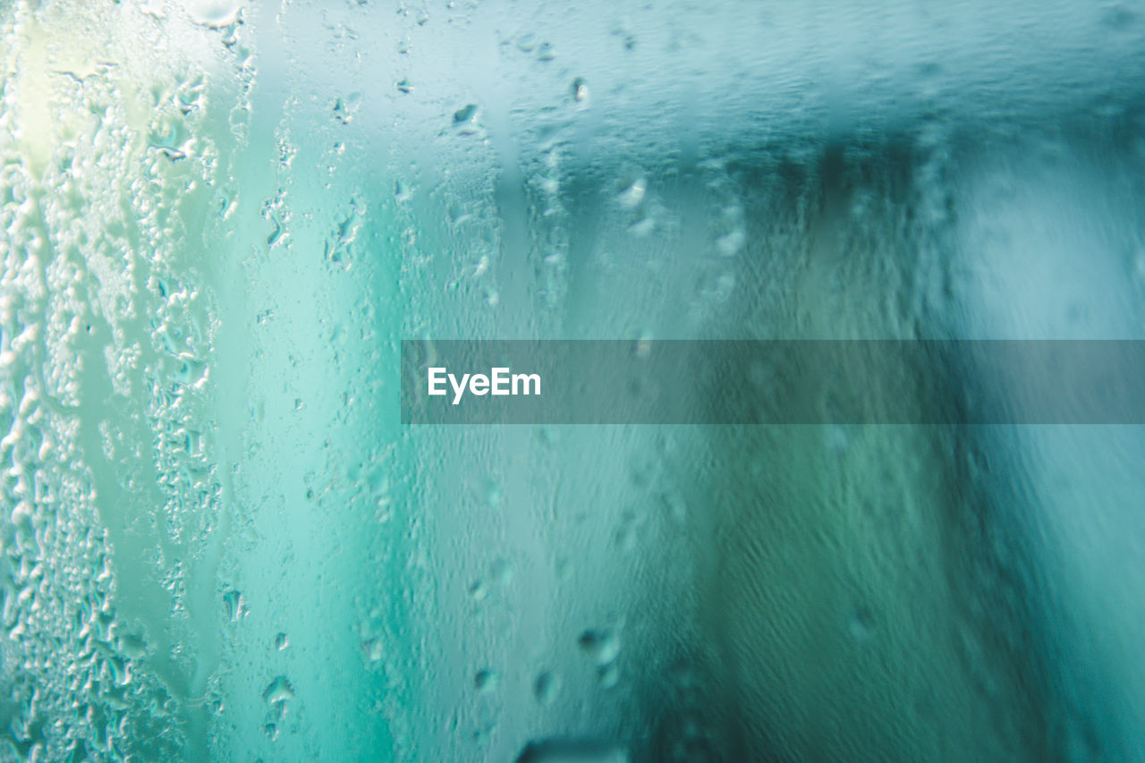 Full frame shot of wet glass