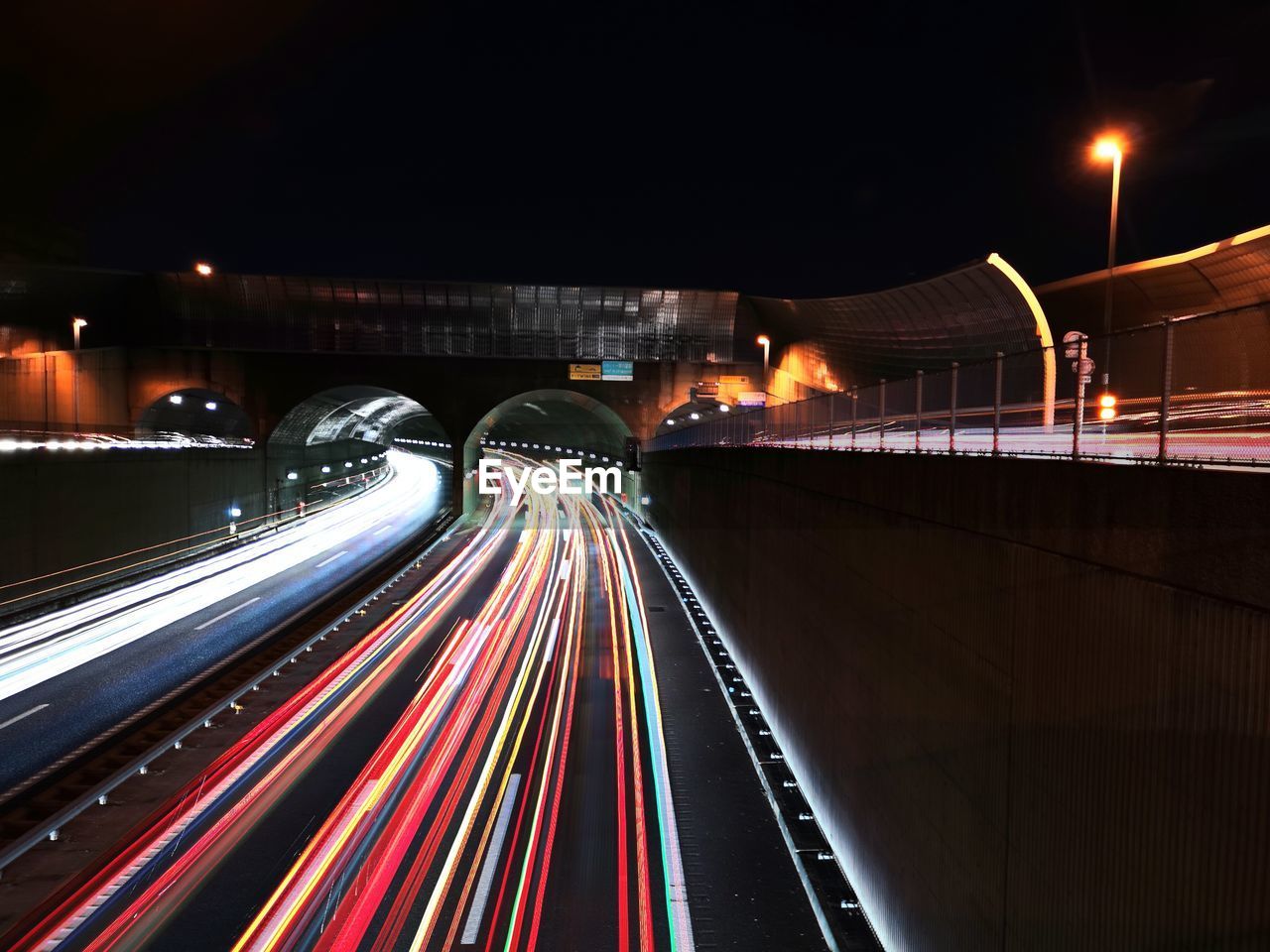 high angle view of light trails on road in city at night