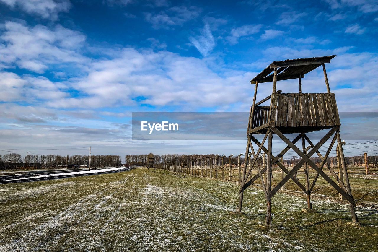 BUILT STRUCTURE ON LANDSCAPE AGAINST SKY