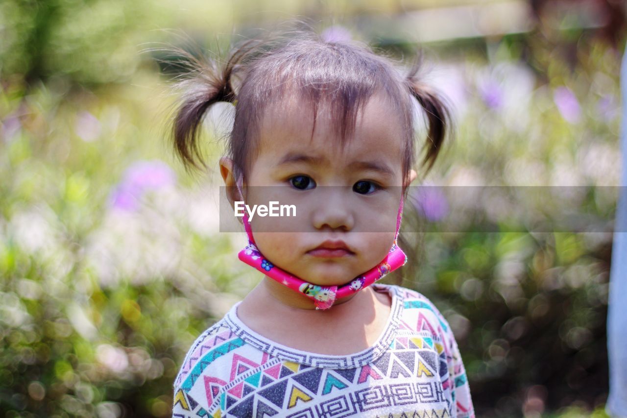 Cute asian toddler big eyes, looking camera  headshot close up view, the portrait children 
