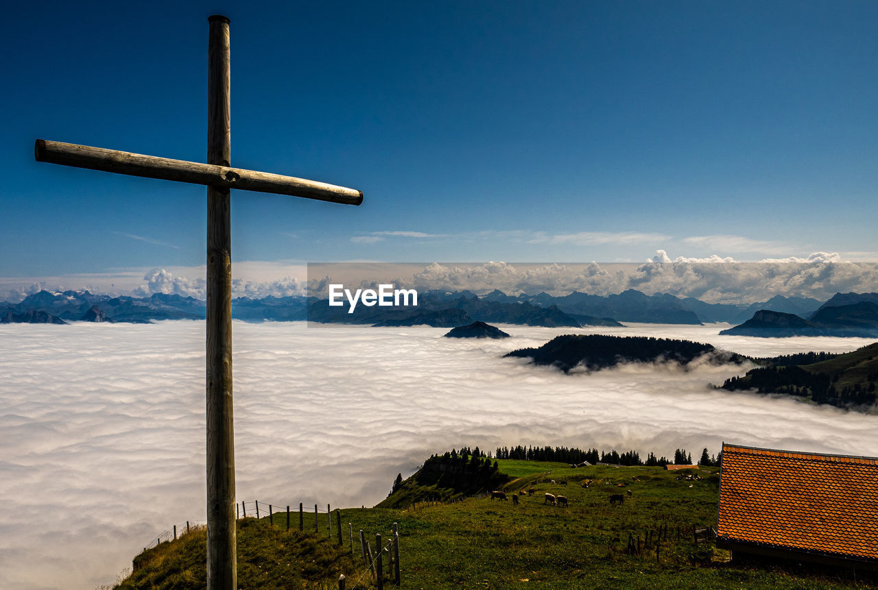 Scenic view of landscape against blue sky