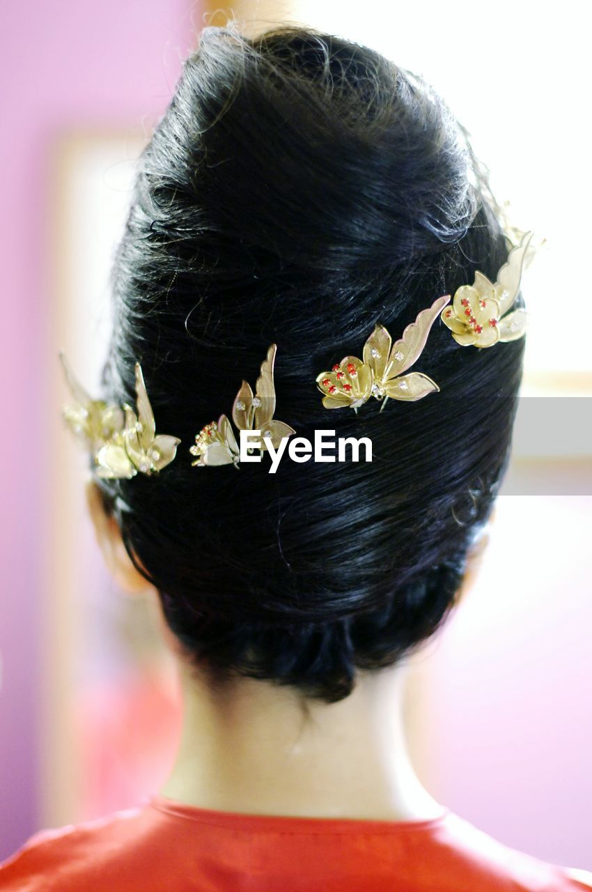 Rear view of woman wearing hair clips