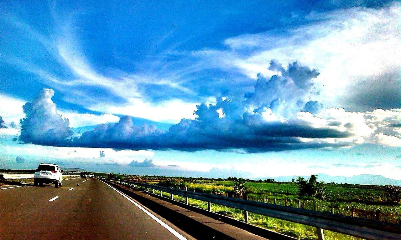 ROAD PASSING THROUGH MOUNTAINS