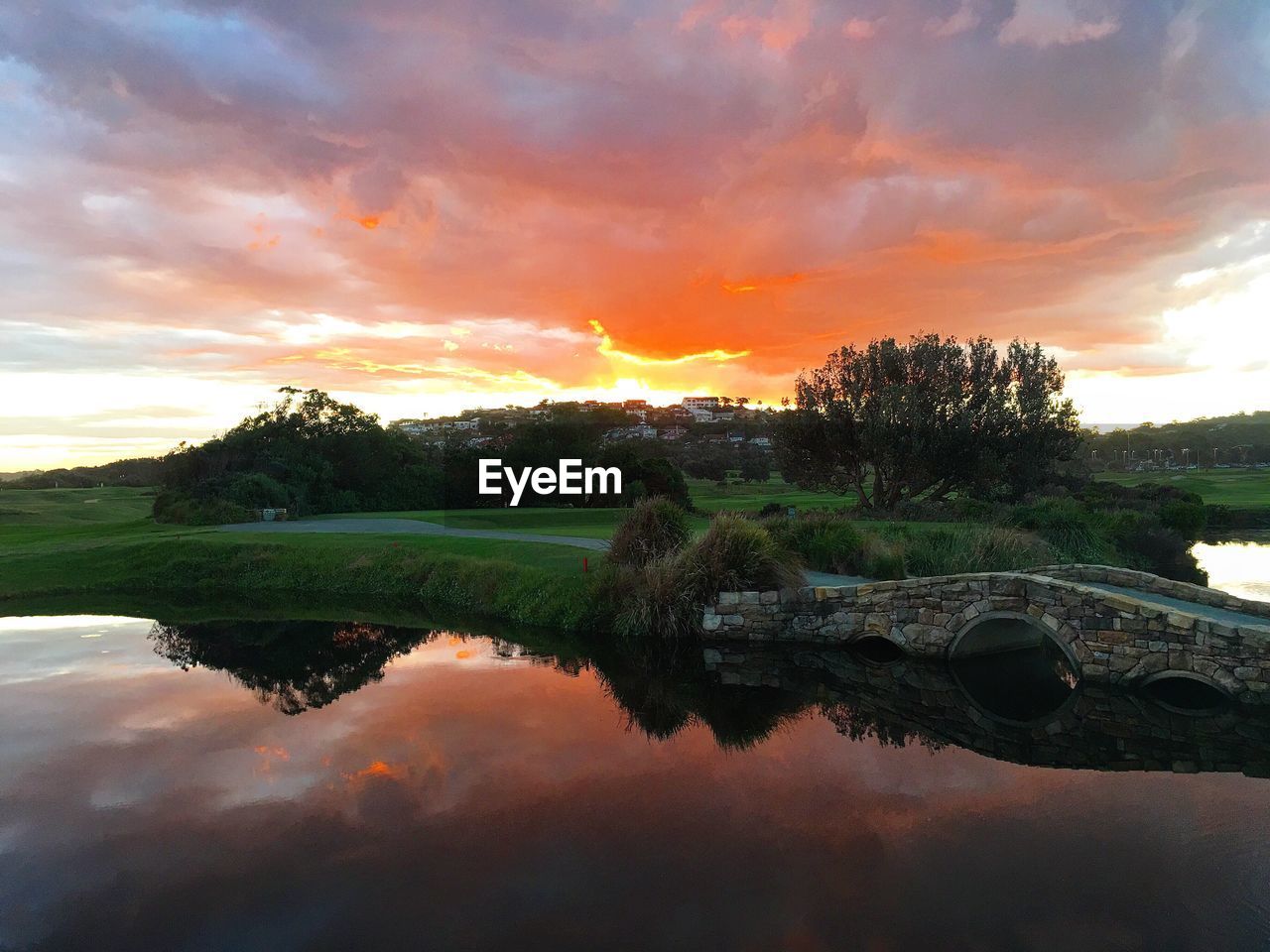 Scenic view of lake against cloudy sky