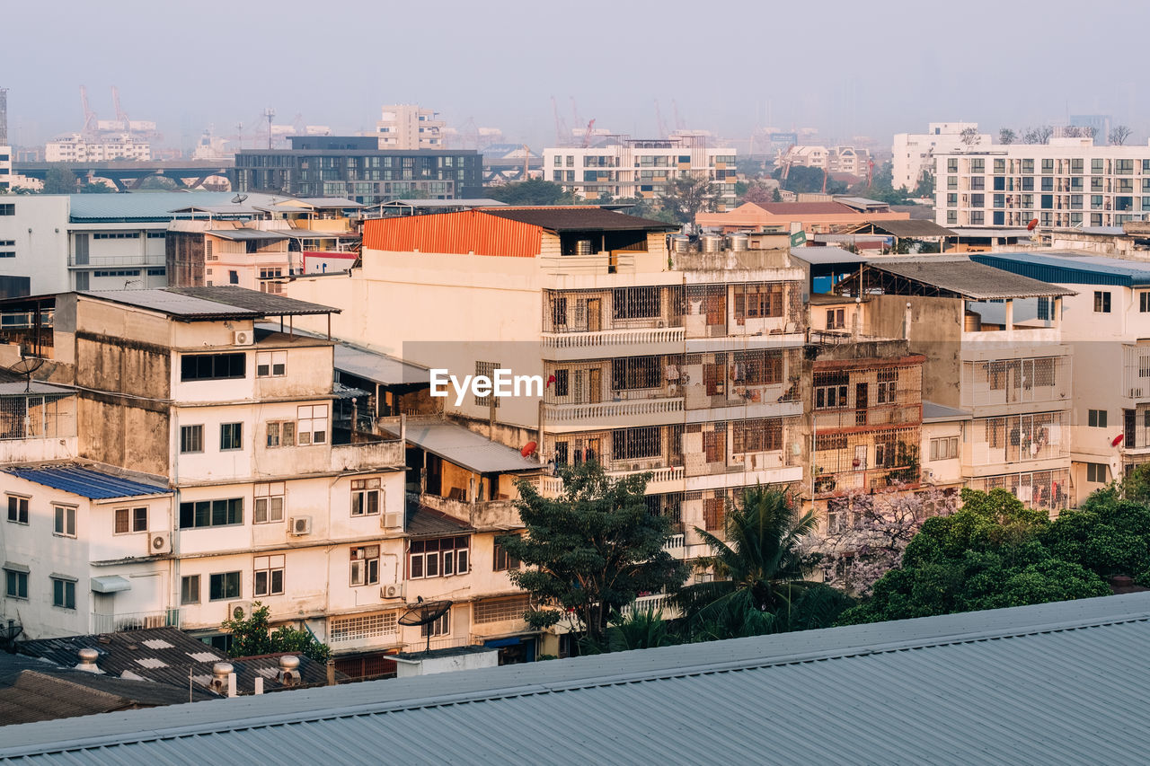 High angle view of residential buildings against sky