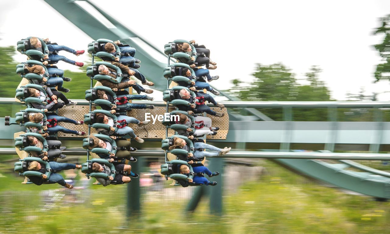 CLOSE-UP OF PADLOCKS ON RAILING BY RIVER