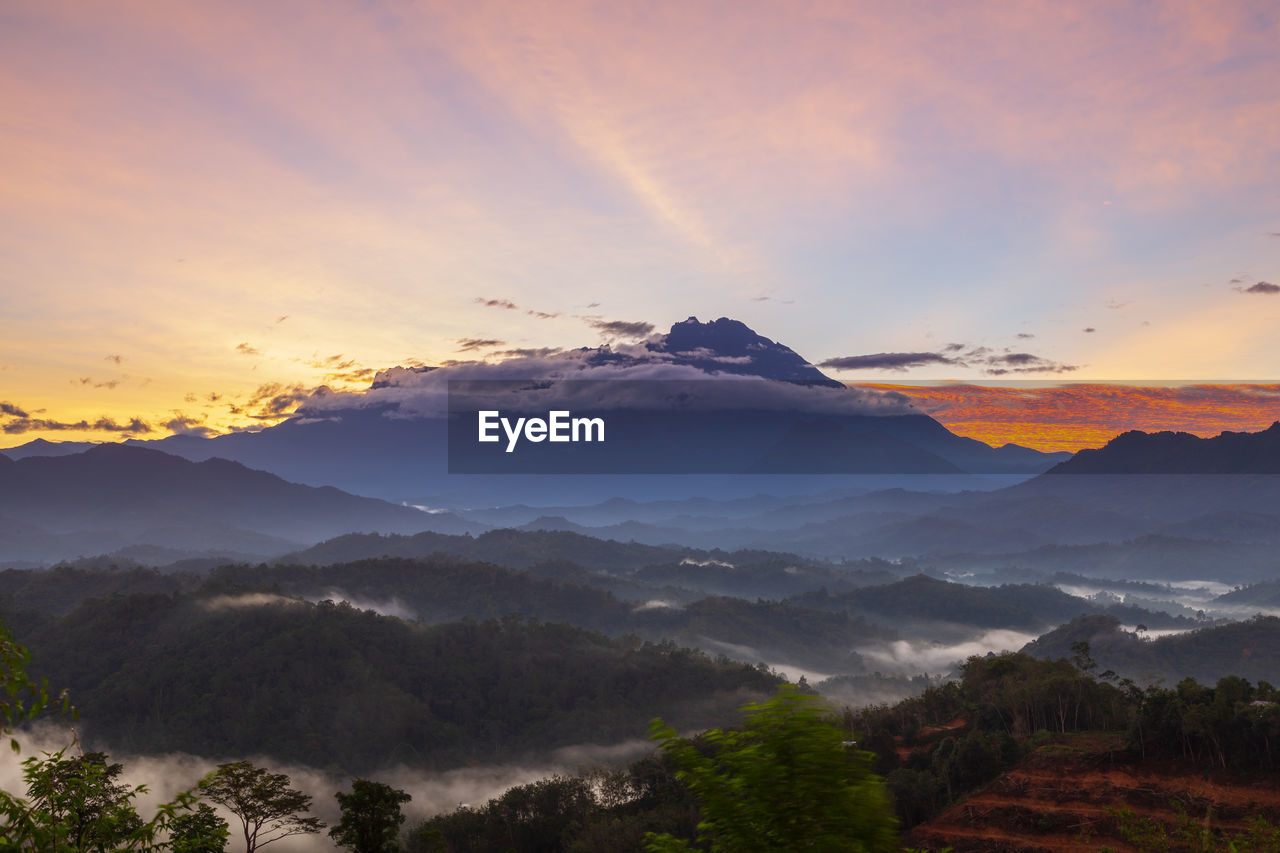 SCENIC VIEW OF MOUNTAINS DURING SUNSET