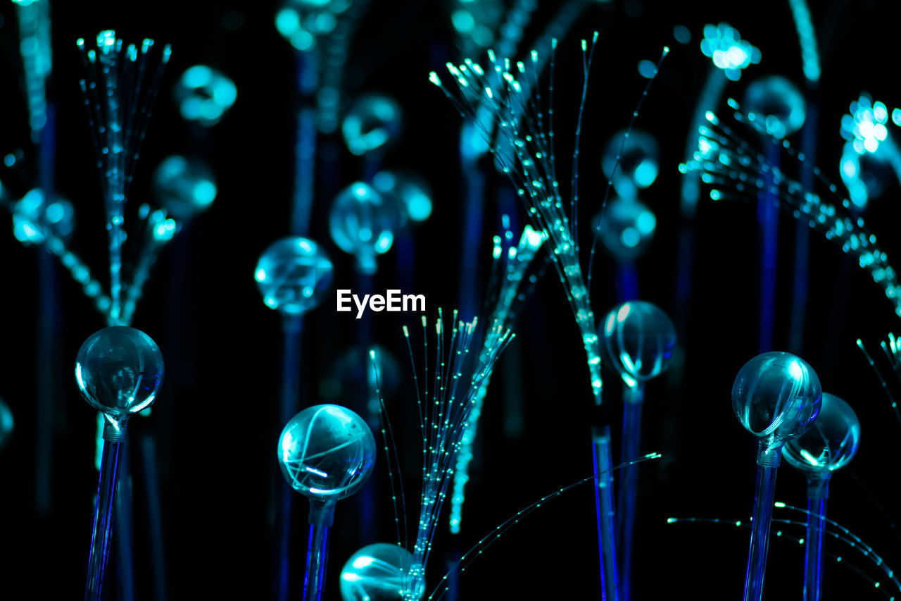 Blue fiber optic strands or filaments creating a magic fantastic abstract background