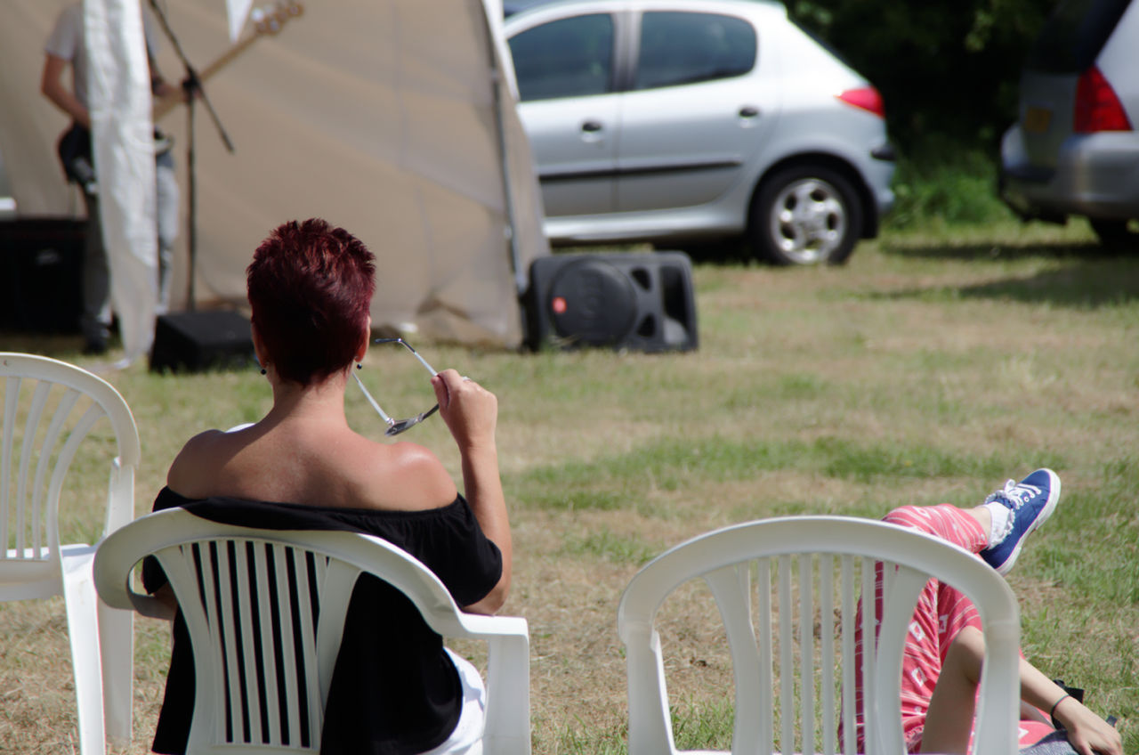 People enjoying music while resting outdoors