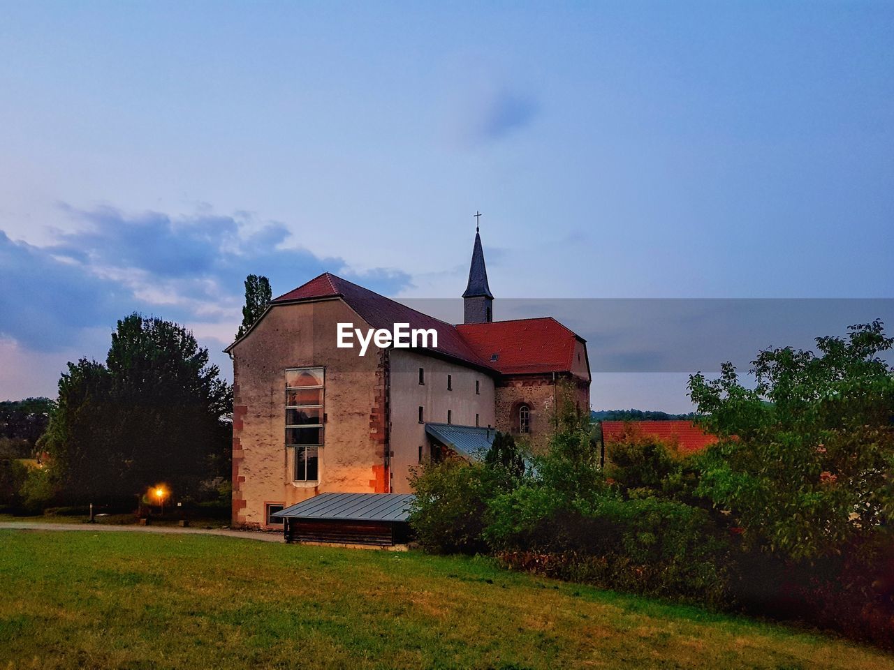 Church on field against sky