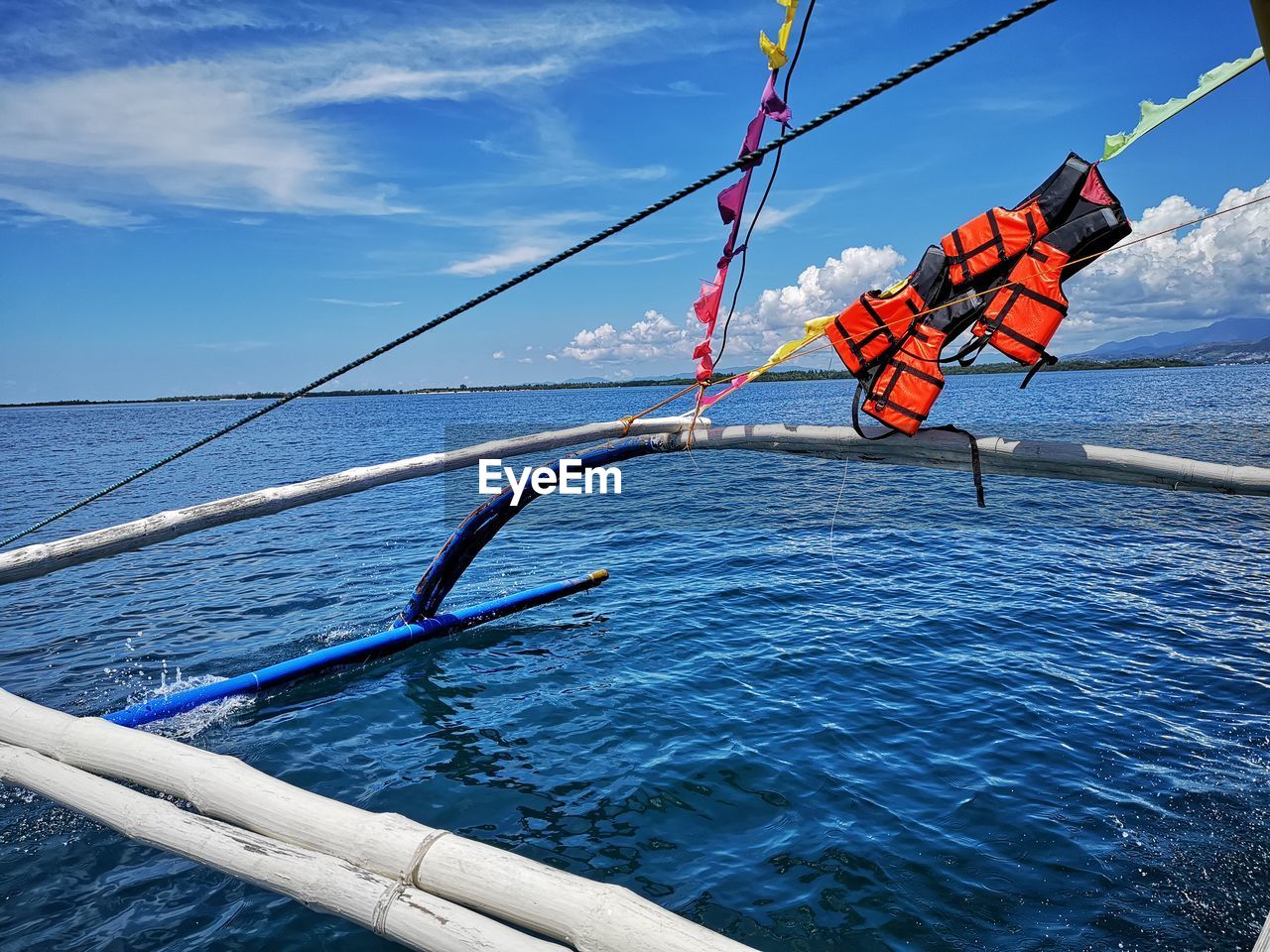 ROPE ON BOAT AGAINST BLUE SKY