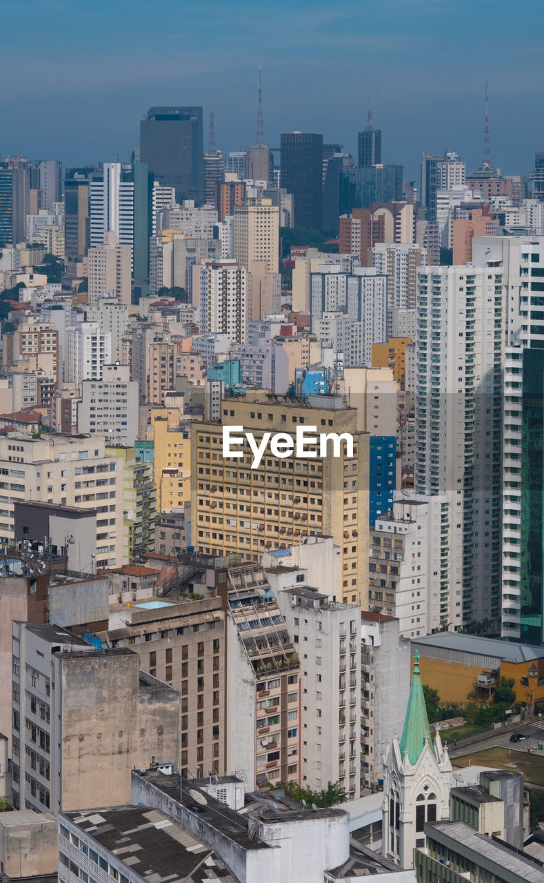 High angle view of buildings in city against sky