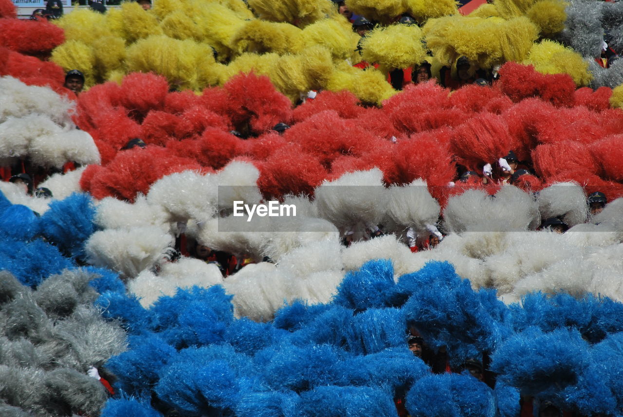 Full frame shot of colorful pom-poms during celebration
