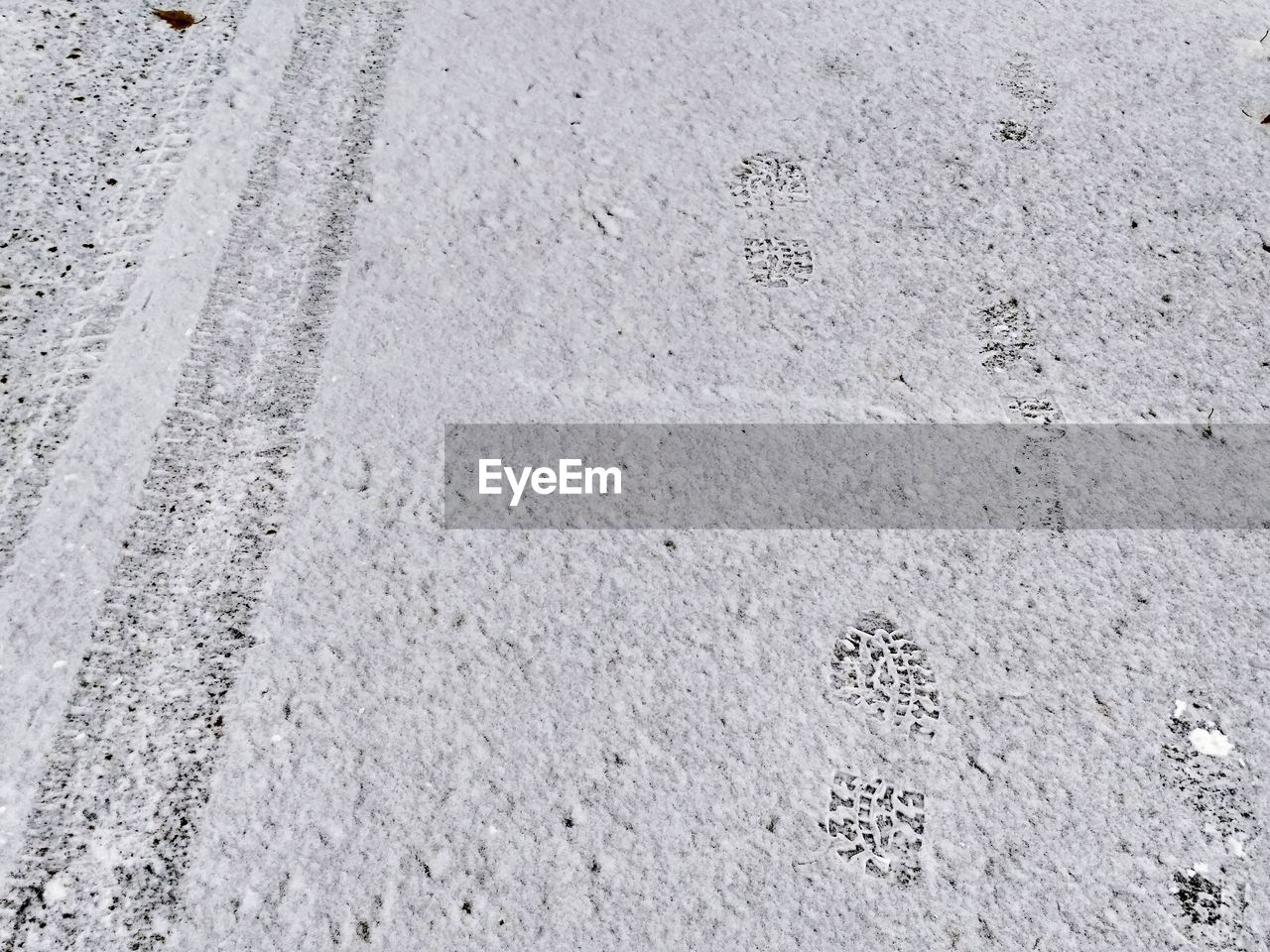 High angle view of footprints on snow