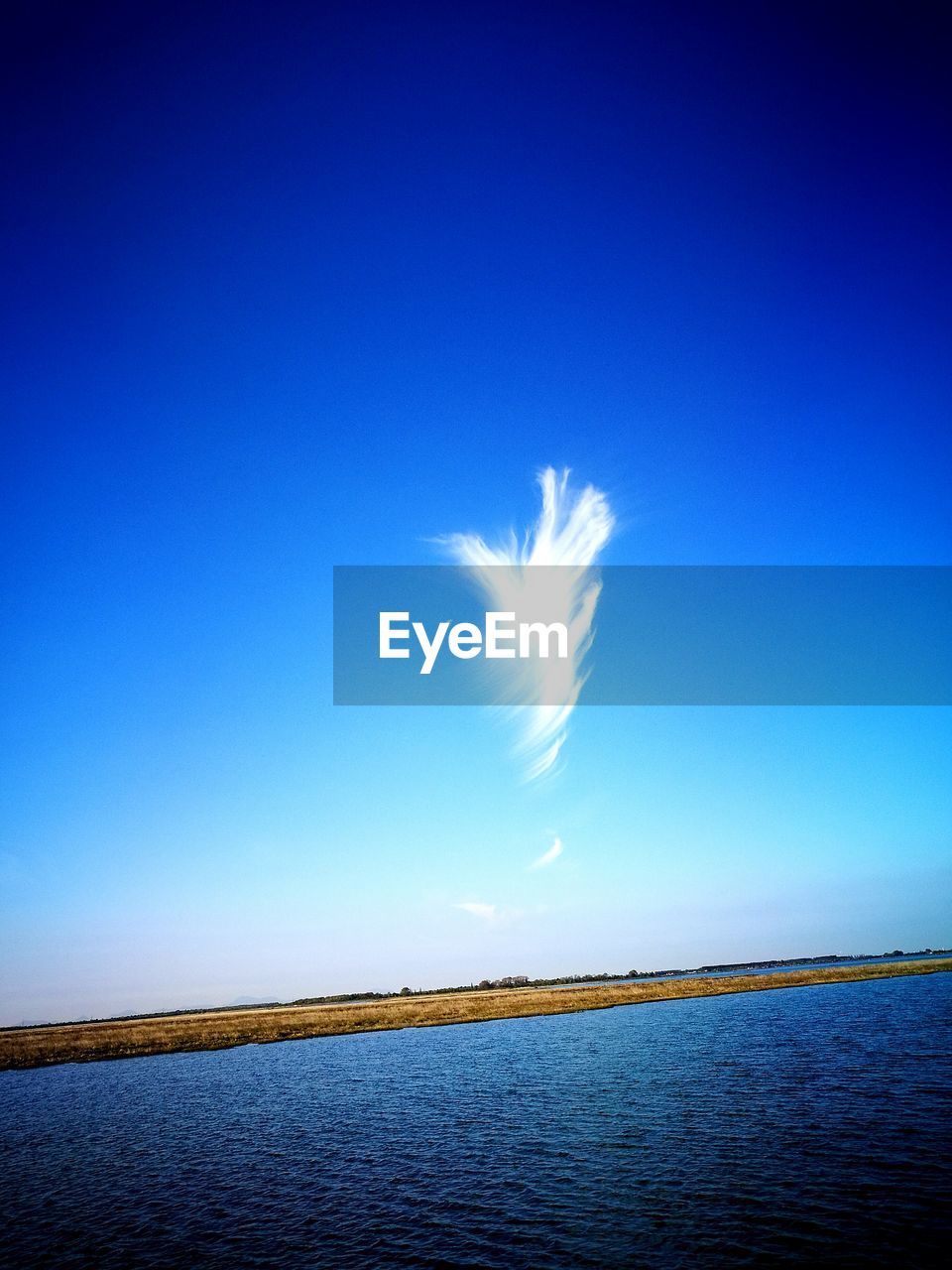 VIEW OF CALM BLUE SEA AGAINST THE SKY