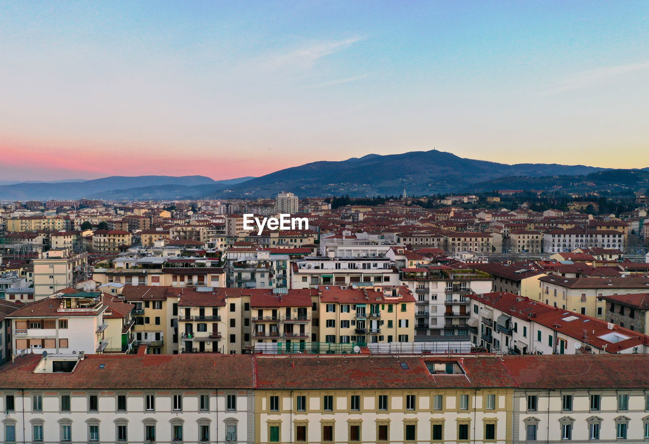 High angle view of townscape against sky during sunset