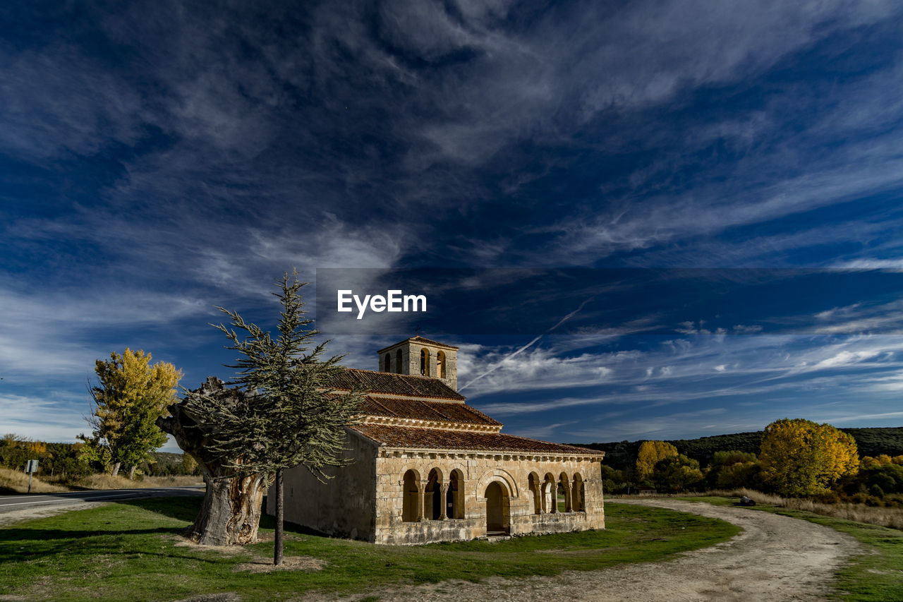 Historic building against cloudy sky