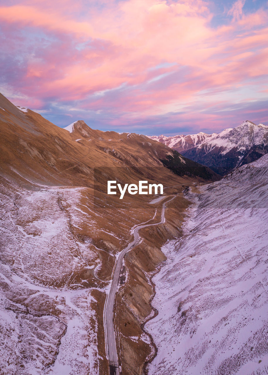 scenic view of snow covered mountains against sky