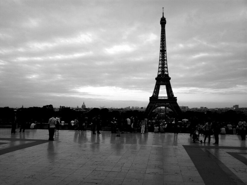 SILHOUETTE OF EIFFEL TOWER AGAINST CLOUDY SKY