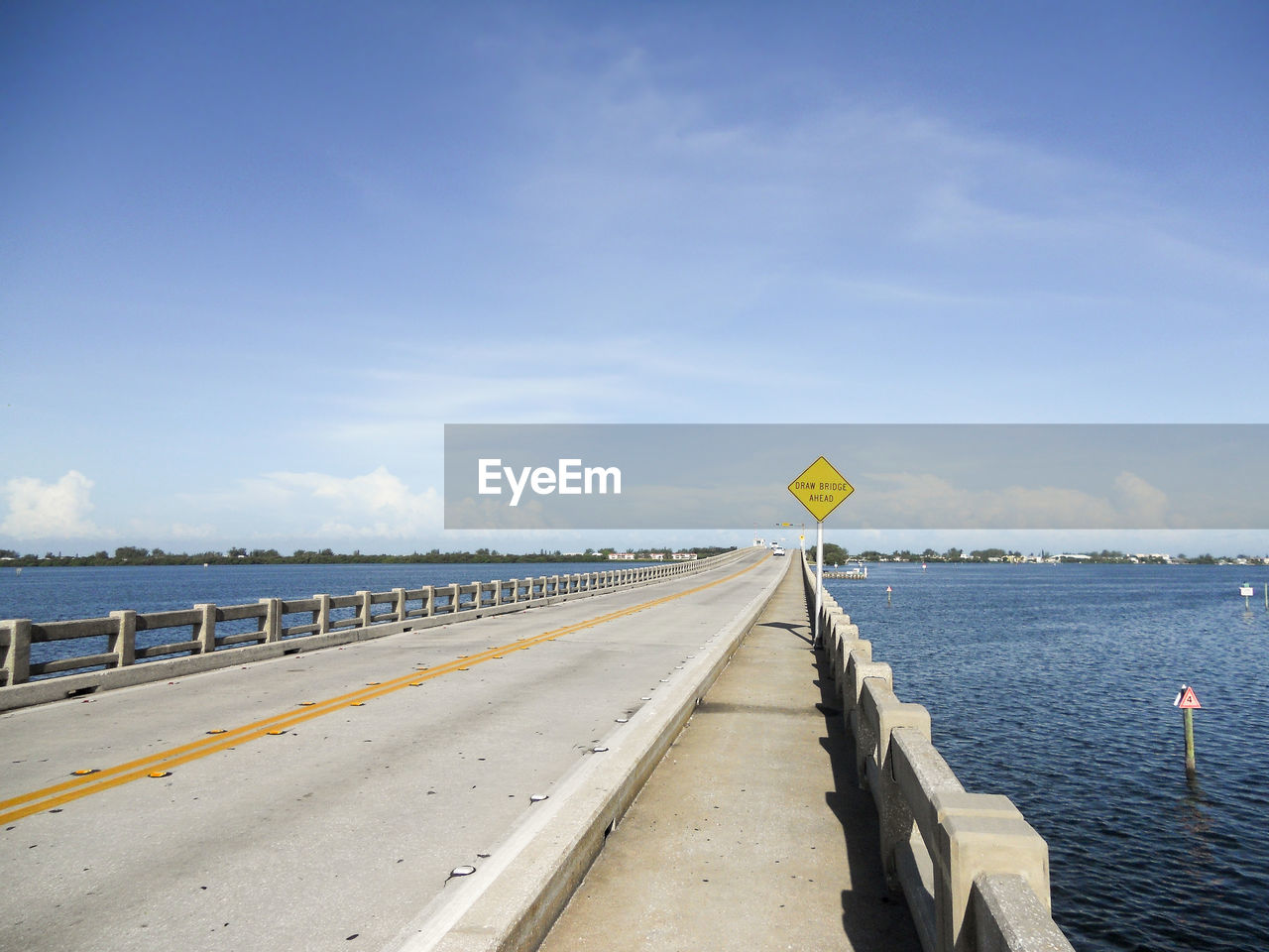 Bridge over sea against sky