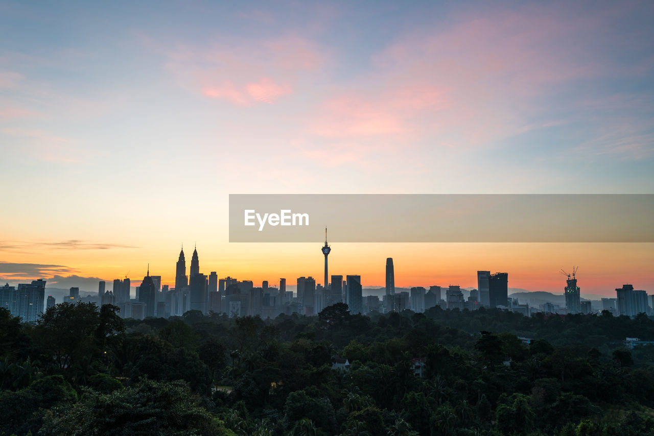 View of buildings against sky during sunset