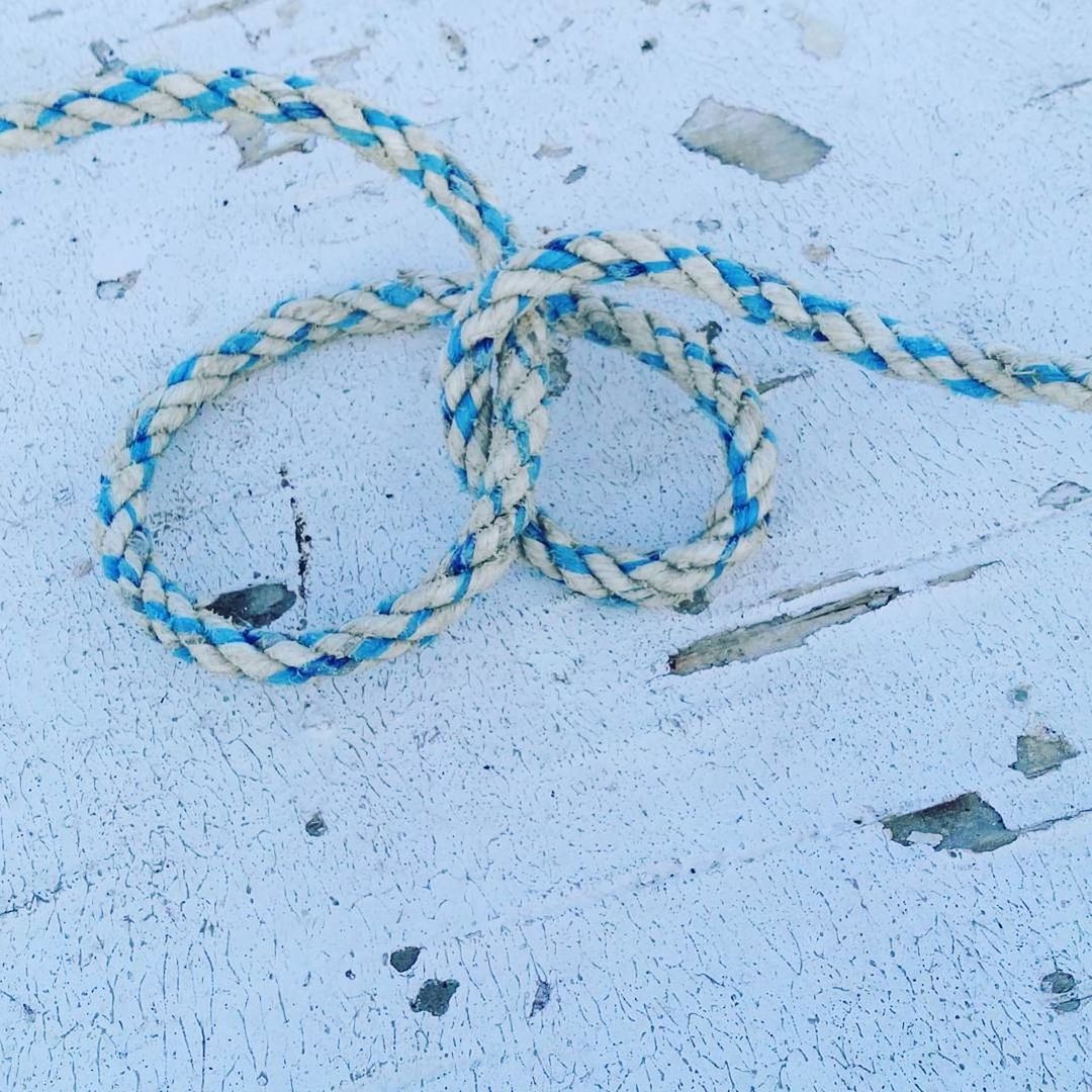 Close-up of rope on weathered wood