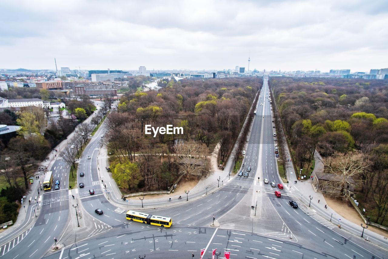 Aerial view of vehicles on road against sky