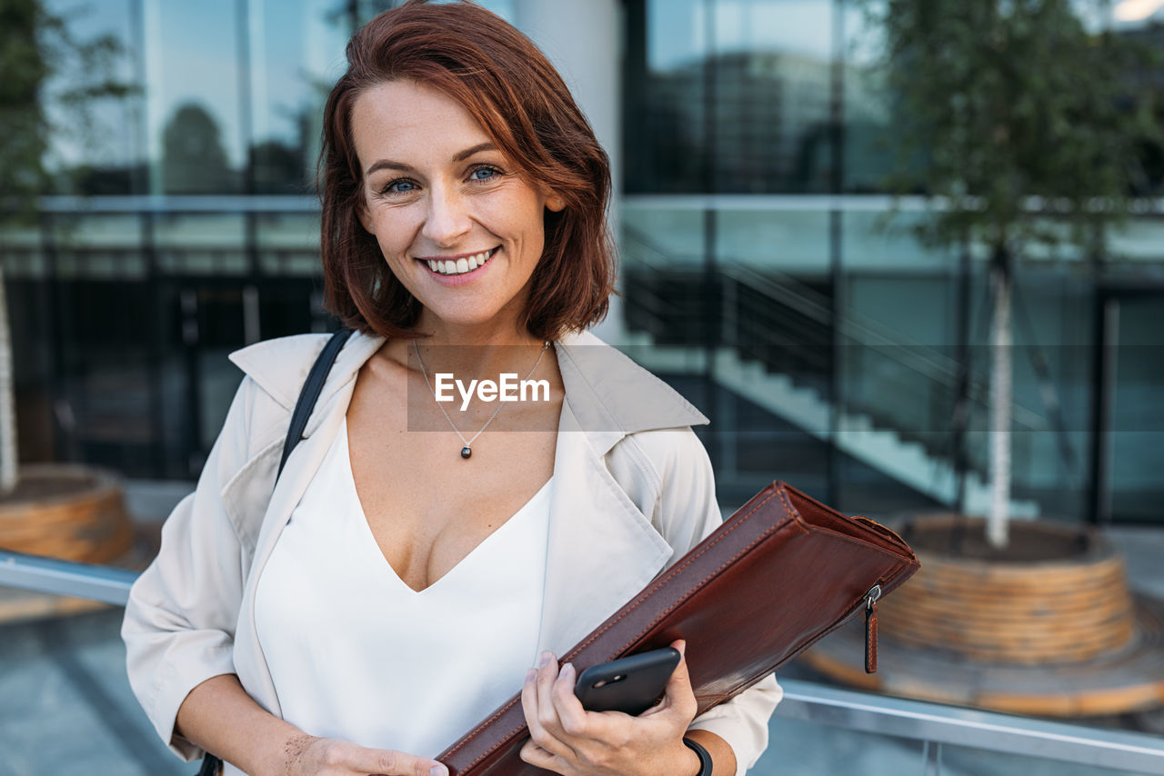 portrait of young woman using mobile phone