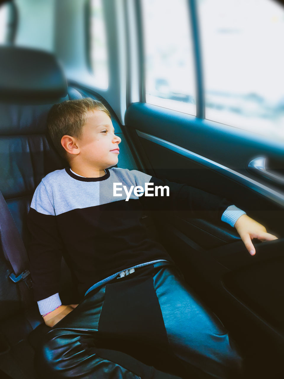 Boy sitting in car