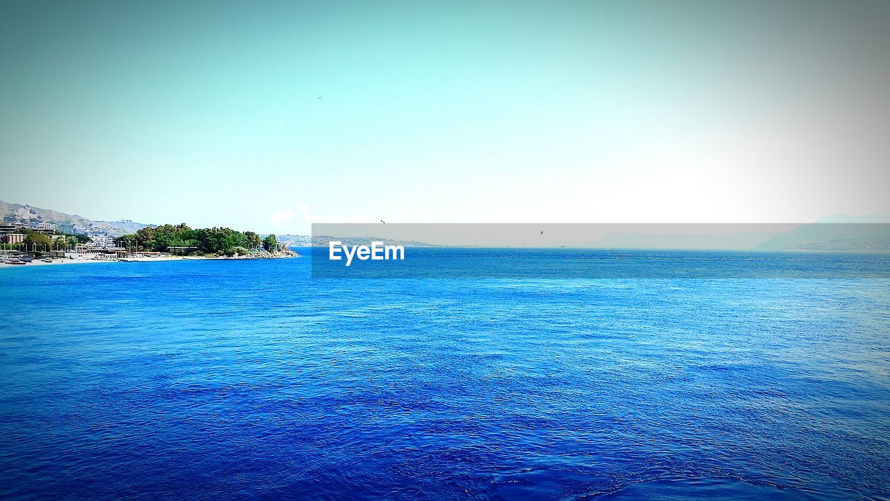 View of calm blue sea against clear sky