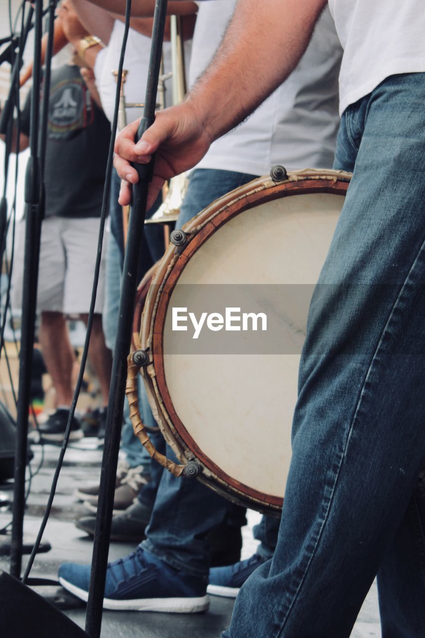 Low section of musicians playing music in city