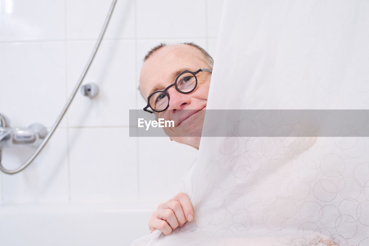 Portrait of man in bathroom